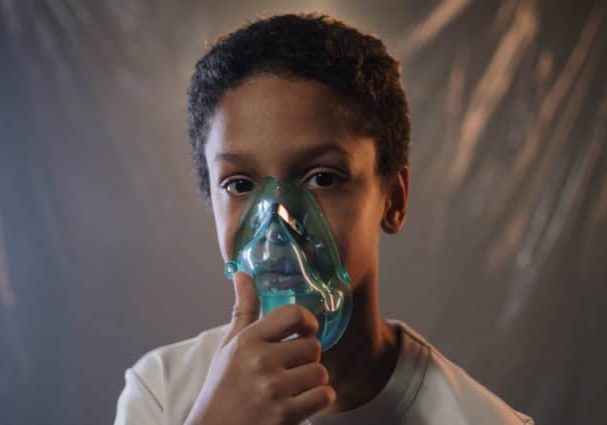 Child with asthma inhaler